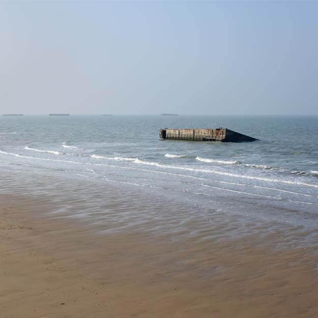 Sea of Arromanches where sections of the mulberry harbour survive to this day