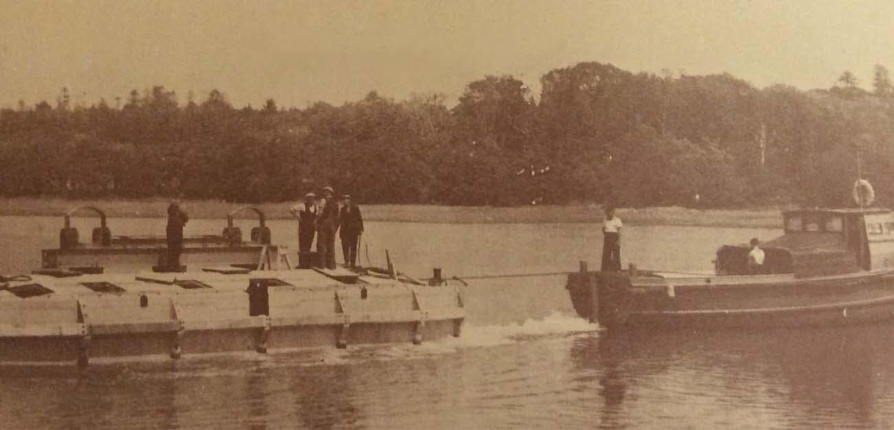 sections of the mulberry harbour being towed away for assembly