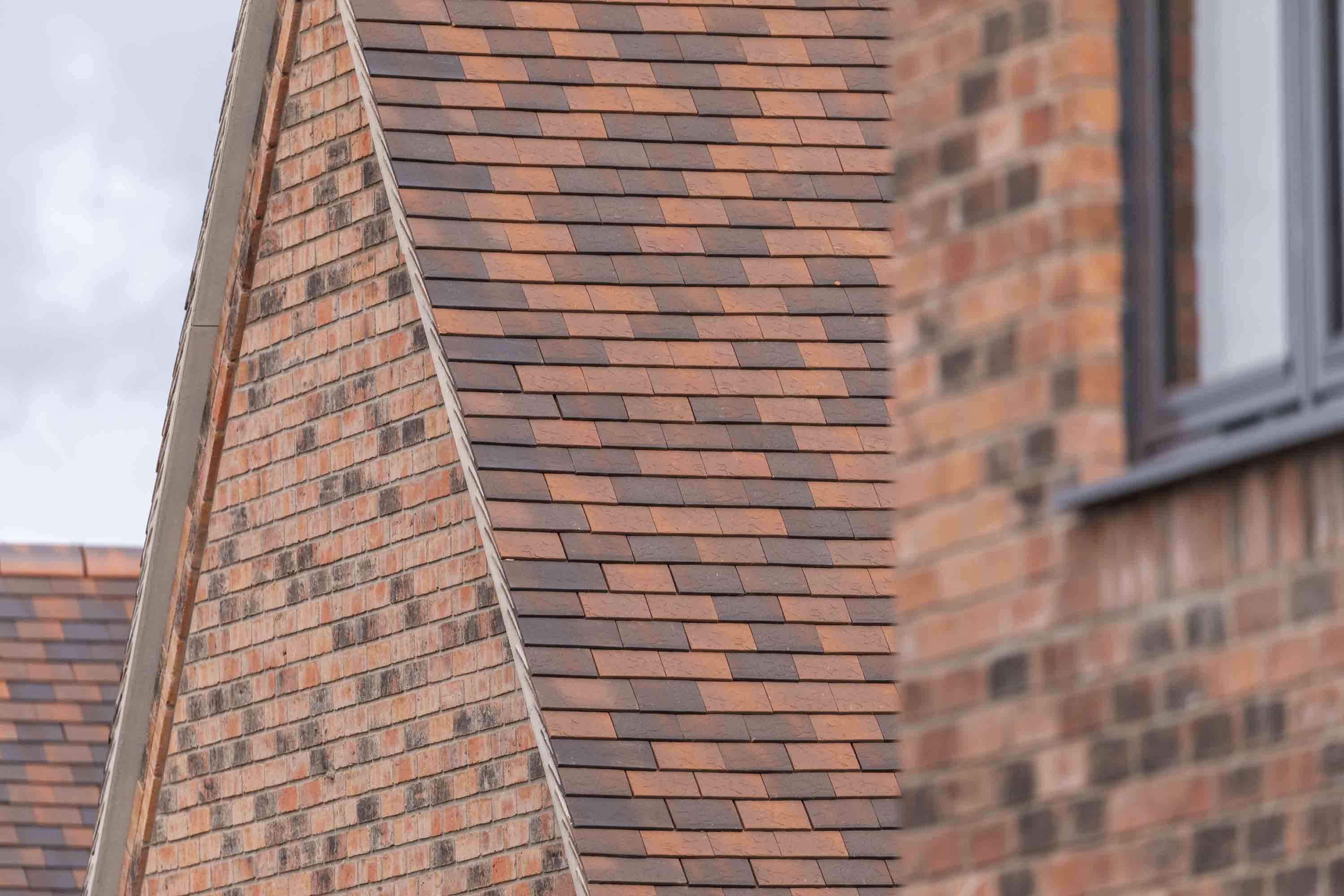 Marley Hawkins clay plain roof tiles installed on domestic home close up shot