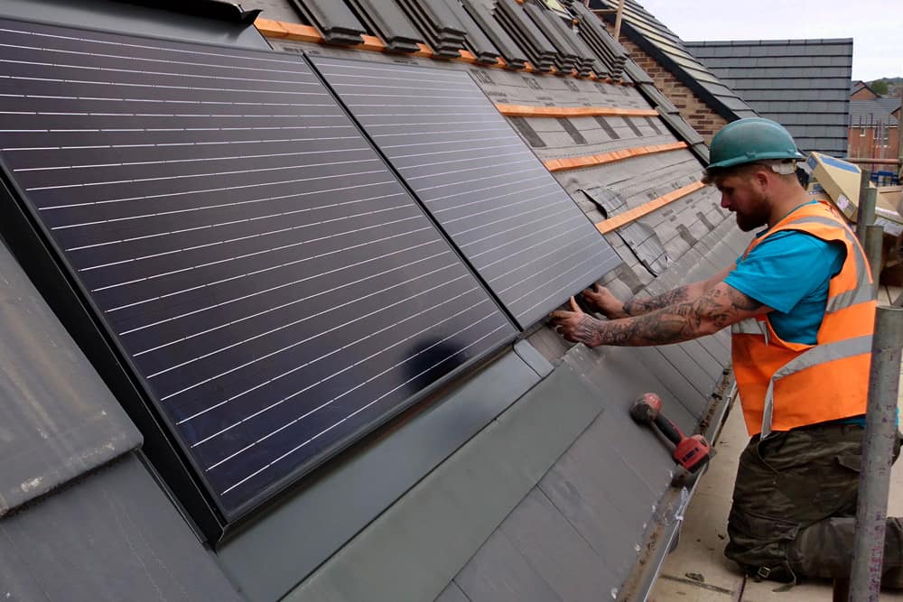 roofer installing Marley solar panels